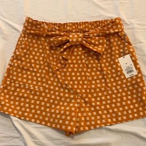 Size XL orange paper bag shorts with tie